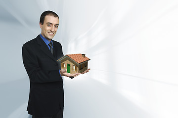 Image showing businessman and house