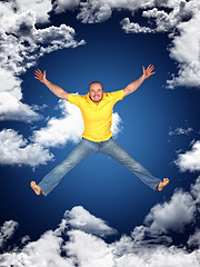 Image showing young man jump and sky
