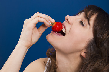 Image showing Eating strawberries