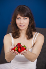 Image showing Eating strawberries