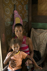 Image showing Nicaragua mother child daughter interior clapboard house Corn Is