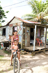 Image showing Nicaragua mother daughter bicycle poverty house Corn Island