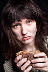 Image showing beggar with a piece of bread