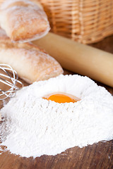 Image showing bread, flour, eggs and kitchen utensil 