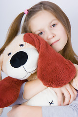 Image showing Girl with toy dog