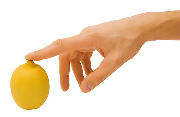 Image showing yellow lemon and male hand