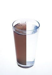 Image showing Clean and dirty water in one glass isolated on white background