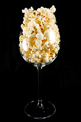 Image showing Wine glass with popcorn