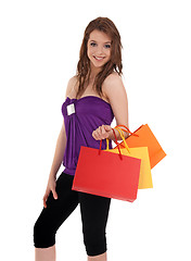 Image showing Smiling girl with colorful shopping bags