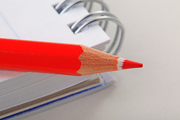 Image showing The notepad and red pencil