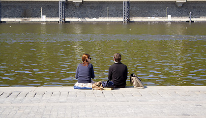 Image showing people sitting on the creek. rest.