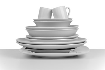 Image showing Pile of clean empty dishes and cups