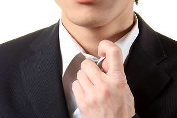 Image showing picture of a business man adjusting his suit