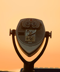 Image showing Viewing binoculars shown at sunrise