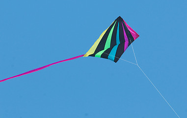 Image showing Multicolored kite on string with tail