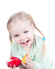 Image showing Little girl playing with colors