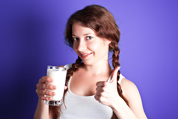 Image showing woman enjoying a glass of milk