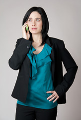 Image showing Worried business woman talking on the cell phone