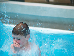 Image showing boy jumping into pool