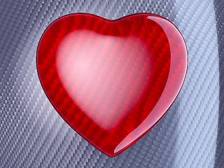 Image showing Red heart shape over carbon fibre