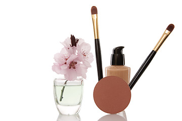 Image showing cosmetics and cherry flower