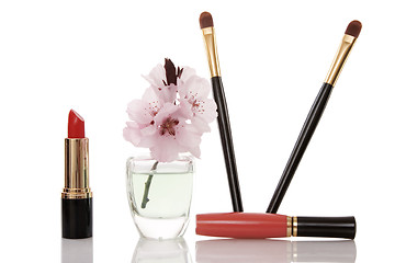 Image showing cosmetics and cherry flower