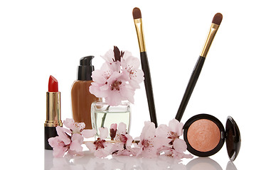 Image showing cosmetics and cherry flower