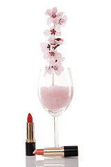 Image showing red lipsticks and cherry flower
