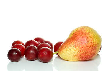 Image showing Yellow-red pear and some cherry plums