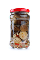 Image showing Glass jar with marinated milk mushrooms