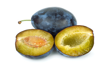 Image showing Whole plum and halves