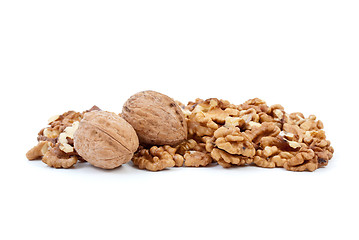 Image showing Two walnuts and some kernels