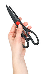Image showing Hand holding kitchen scissors