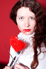 Image showing woman with red heart on a fork