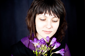 Image showing beautiful woman with purple flowers