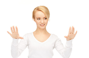 Image showing businesswoman working with something imaginary