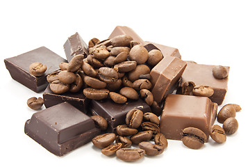 Image showing Heap of coffe beans and chocolate on white