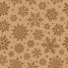 Image showing Seamless pattern with snowflake on packing cardboard background.