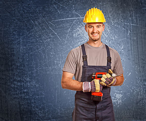 Image showing handyman and grunge background