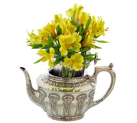 Image showing Silver Teapot with Bunch  of Yellow Flowers 