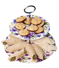 Image showing Retro Plates with Chocolate Biscuits and Asparagus Rolls