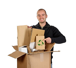 Image showing young man recycling cardboard
