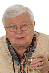 Image showing Senior woman drinking water