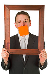 Image showing Businessman with wooden frame