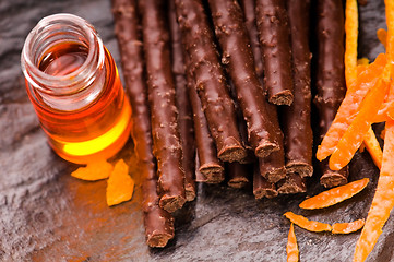 Image showing chocolate sticks with orange