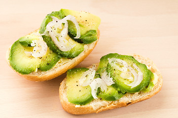 Image showing Sandwich with avocado on a wooden board 