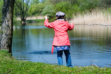 Image showing Happy Cute Little Girl At A Lake