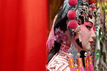 Image showing chinese opera dummy and red cloth as text space ,it is a toy,not