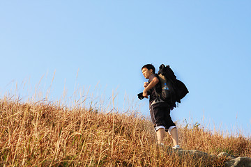 Image showing Sport hiking in mountains, walking and backpacking 