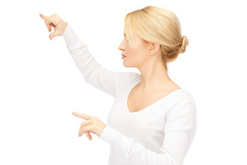Image showing businesswoman working with something imaginary